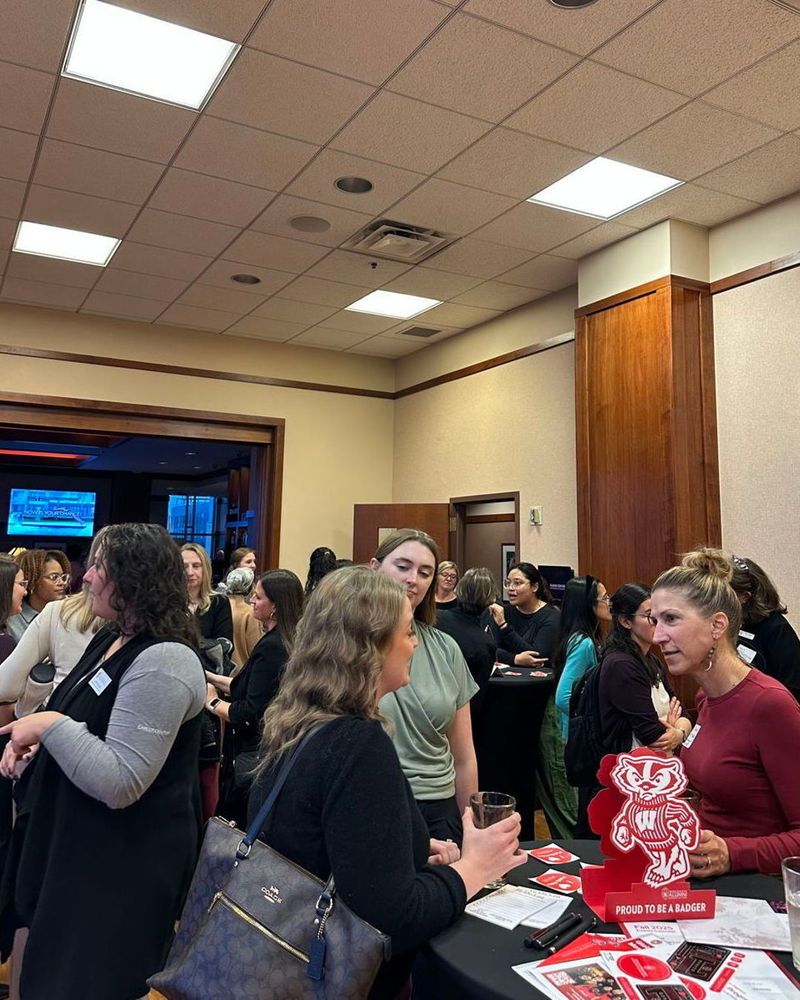 Students, alumni, and panelists network during the event.