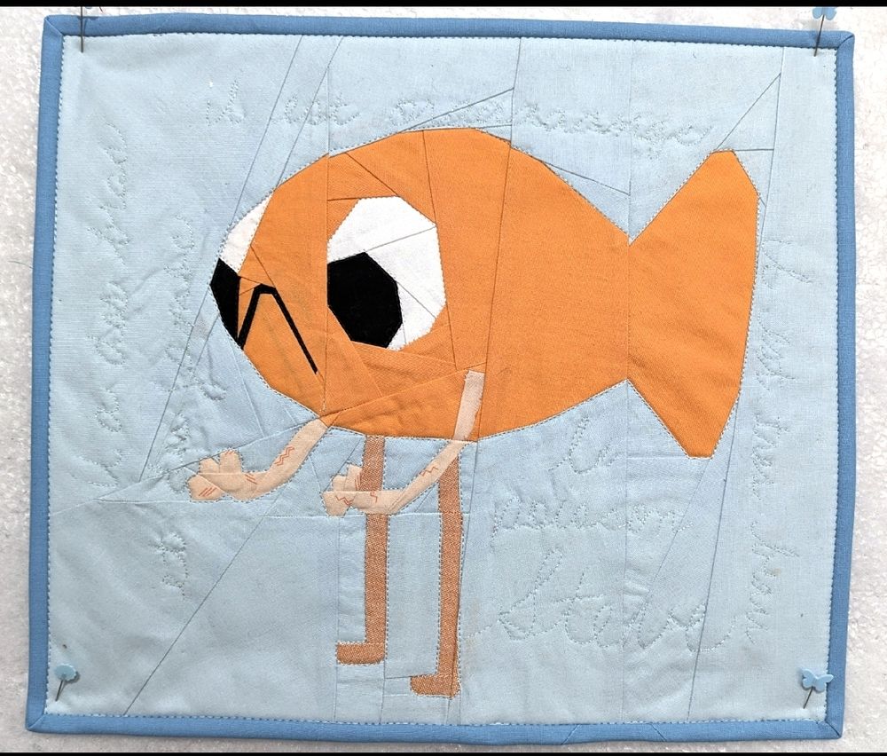 Poisson Steve quilt with a light blue background
