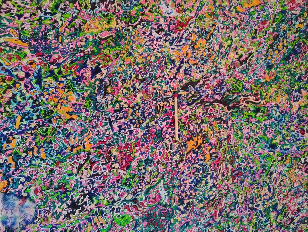 Semi-closeup of "horror vacui" (a fear of empty spaces) style artwork in multicolor abstract. Photo taken without flash, iirc. Random squiggles of color, some outlined, filling a ~10x14" page. Visible damage, including water damage. Standard kitchen matchstick for scale. 