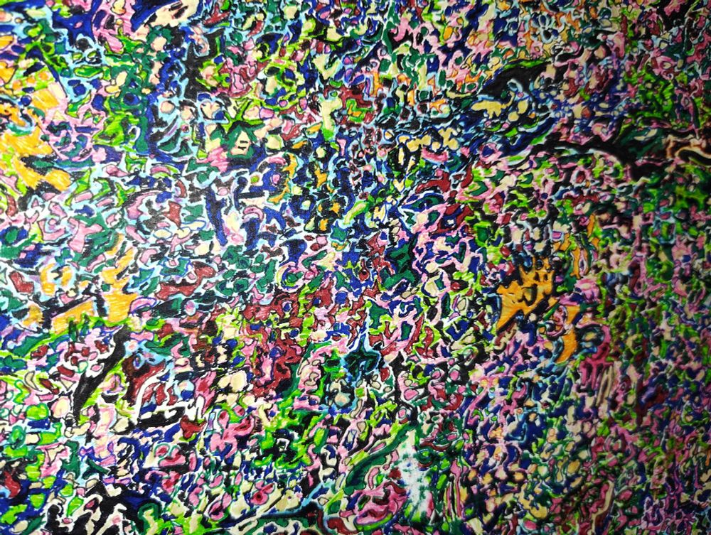 Closeup of "horror vacui" (a fear of empty spaces) style artwork in multicolor abstract. Photo taken with flash. Random squiggles of color, some outlined, filling a ~10x14" page. 