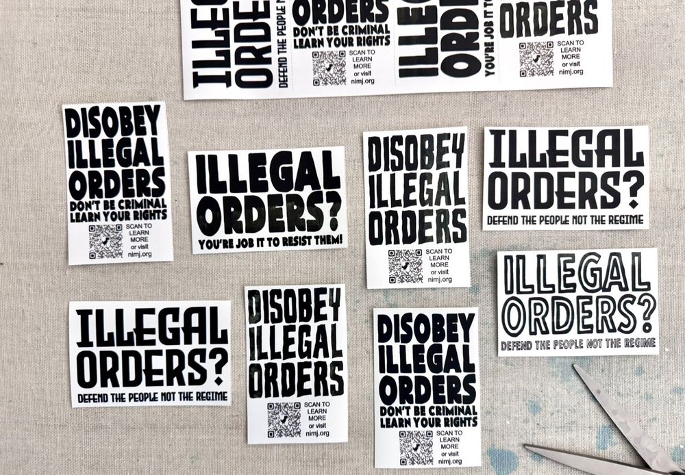 A bunch of protest stickers cut from a sheet.