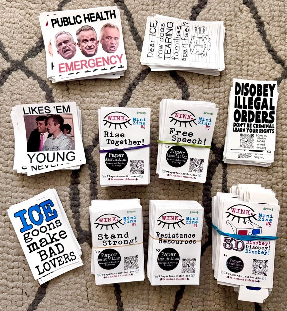 A bunch of resistance and protest stickers and zines ready to hit the streets.