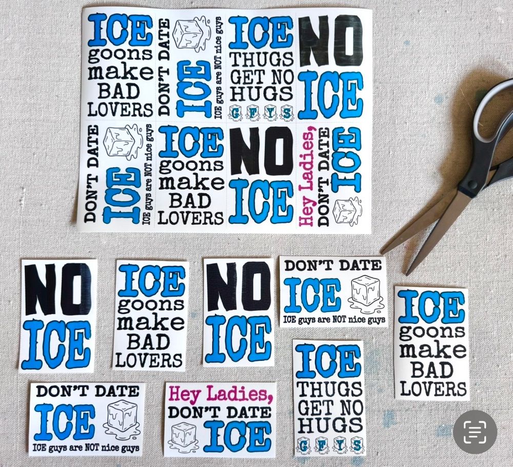 A bunch of protest stickers cut from a sheet.