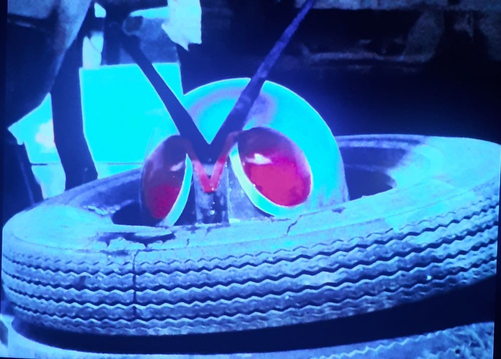 Kamen Rider X up to his eyes in tires