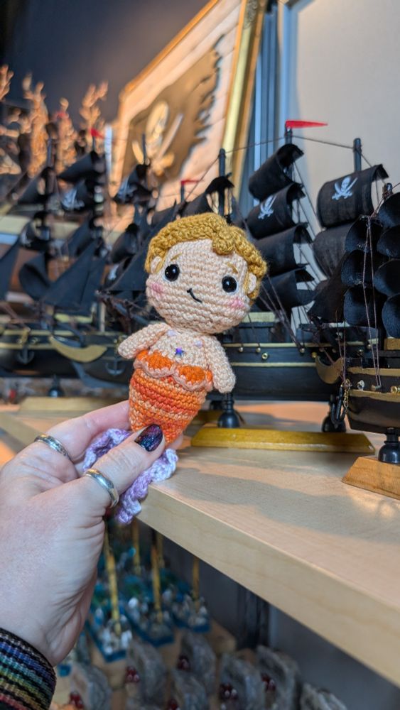 Baby MerStede posing in front of replica shops at The Real Pirate Museum gift shop in Salem. 