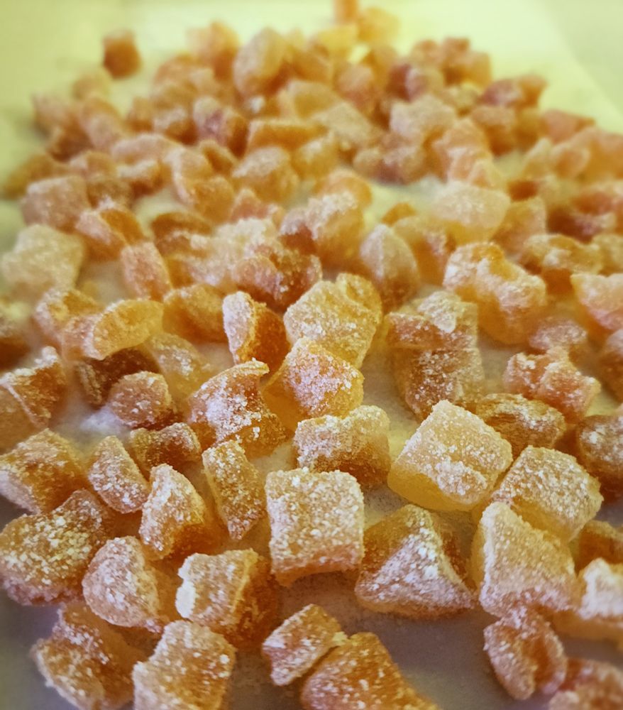 Image of sugar coated cubes of citrus fruit