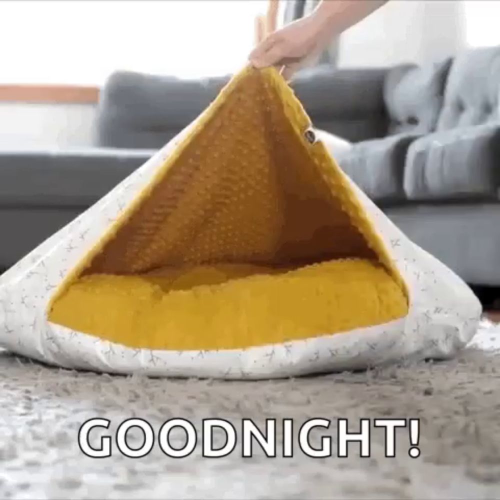 a person is opening a dog bed that says goodnight on the bottom