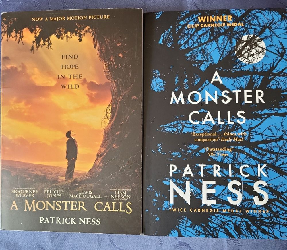 Two copies of "A Monster Calls" by Patrick Ness with different covers. 