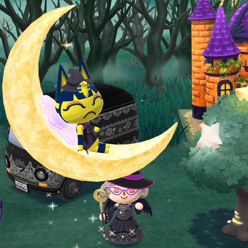Ankha resting in a floating crescent moon. She is a yellow cat with blue stripes and is wearing a witch outfit 