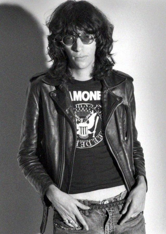 Picture of Joey Ramone with hands in his pockets. 