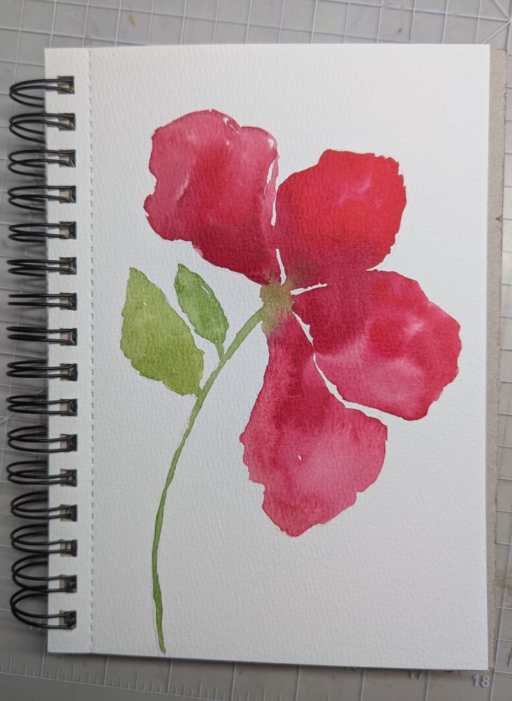 Red watercolor flower with green stem two green leaves on the left side 