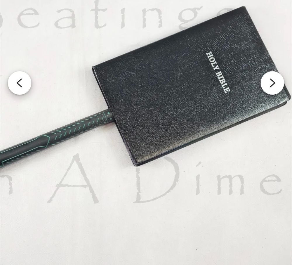 Bible paddle from Beating on a dime.
It's a Bible on a stick for BDSM play.