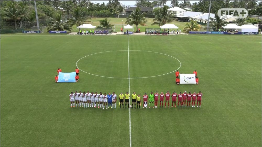 Tonga and American Samoa women's national teams line up with the referees before kick-off