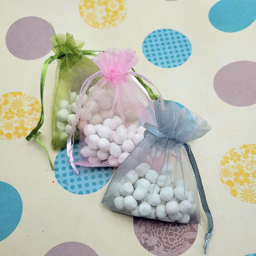 Three scent pouches lined up against a colorful scrapbook paper background.

The green pouch is the bard scent - Notes of champagne, litchi, pink berries, bergamot, black cherries, pink peony, rose, and freesia. Bottom notes of white musk, amber, and vanilla.

The pink pouch is the Dancer scent - Notes of bergamot, spicy pink peppercorn, magnolia, cinnamon, clove, ginger and patchouli. Bottom notes of myrrh, tonka bean, and vanilla.

The light blue pouch is the Machinist scent - Notes of patchouli, warm sandalwood, black pepper, citrus. Bottom notes of vetiver.