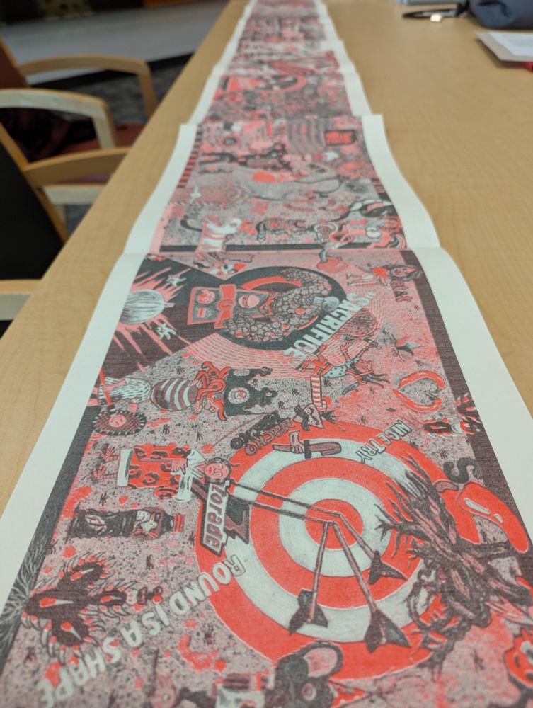 Codex format book displayed long on a table.