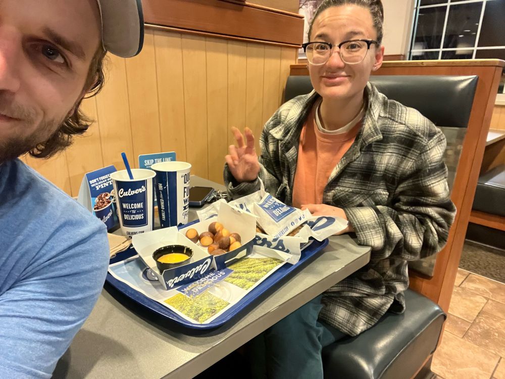 Jax and Bryan about to eat their full plate of Culver’s fast food in Kentucky. 