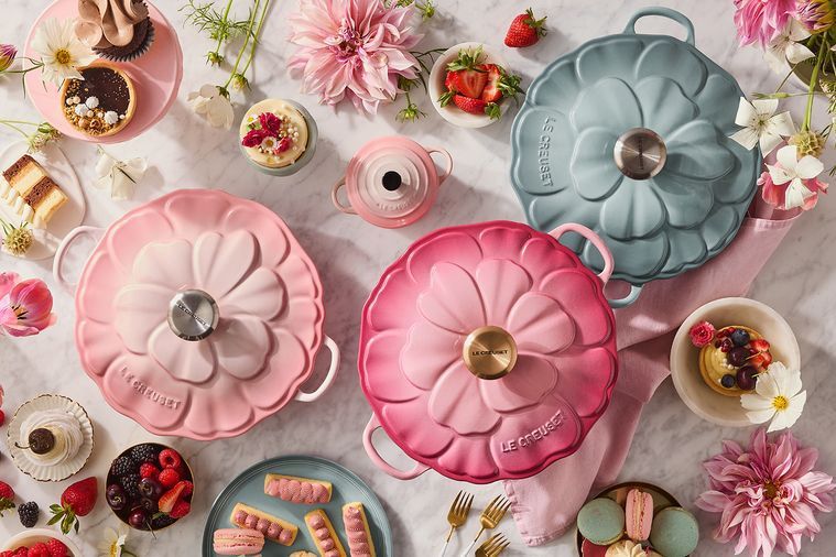le creuset’s new range of cookware, 3 floral casserole dishes are pictured 