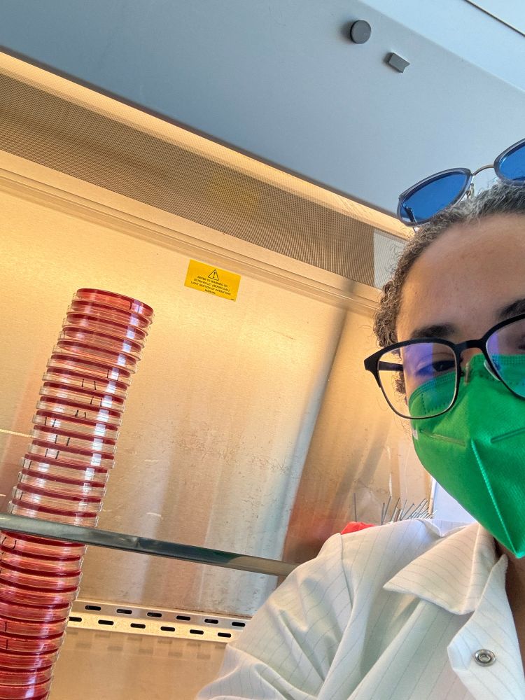 Me with my green KN95 and barrier lab coat showing you all the bright red plates I was about to streak.