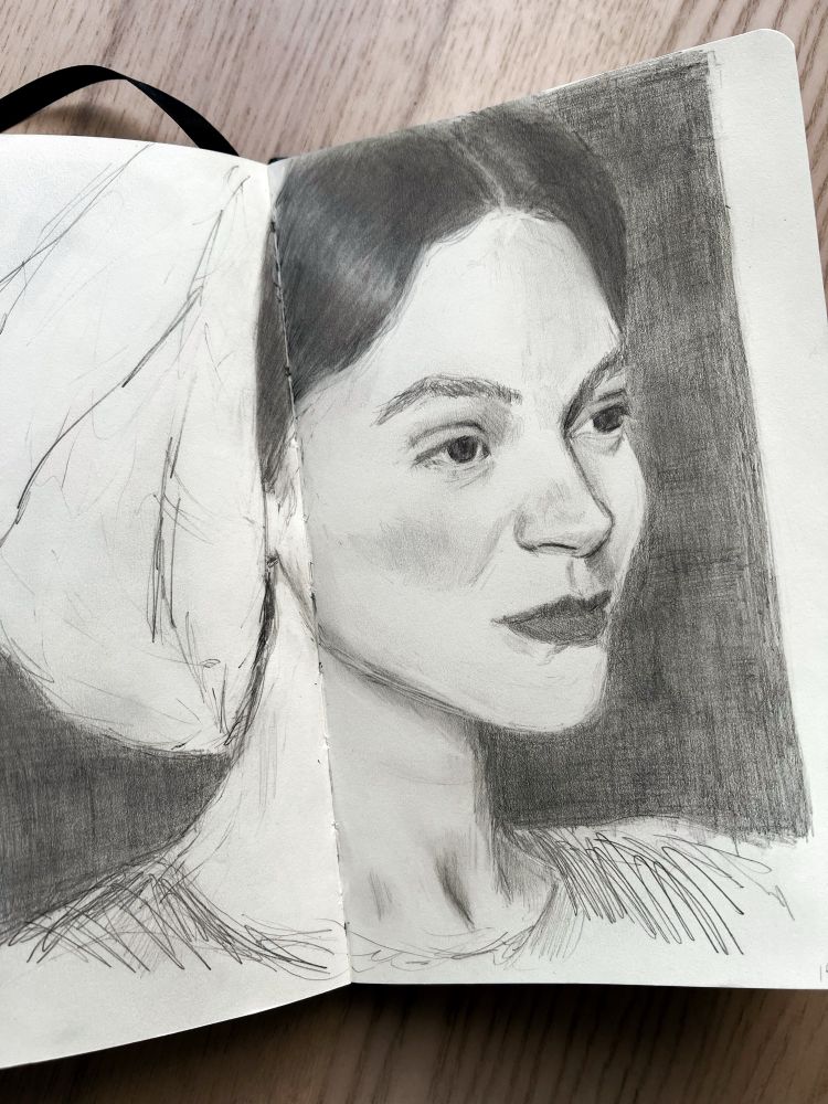 Graphite drawing of woman looking into the distance.