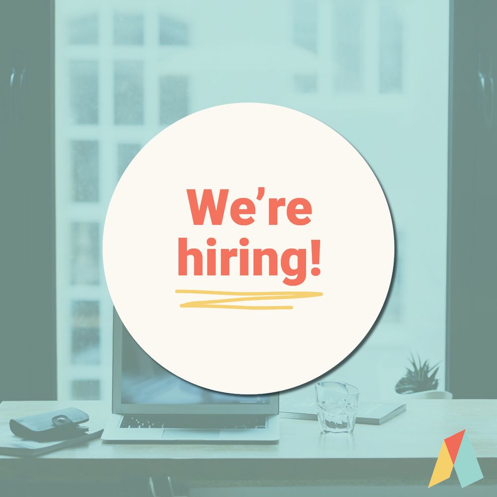 blue office background with a white circle overlayed that says "We're hiring!" 