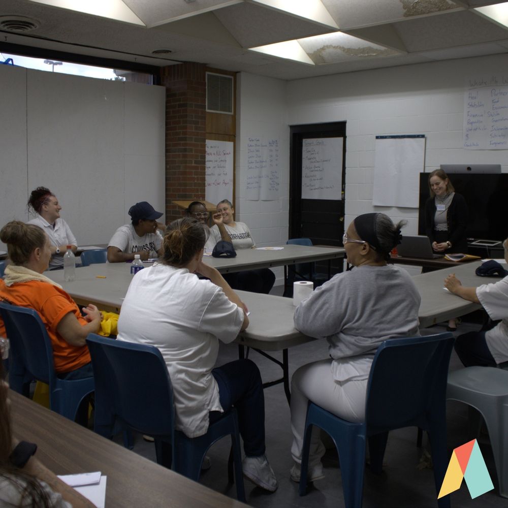 Ascend Justice attorney Mary Kate Winn teaches a class of incarcerated women at Logan Correctional Facility