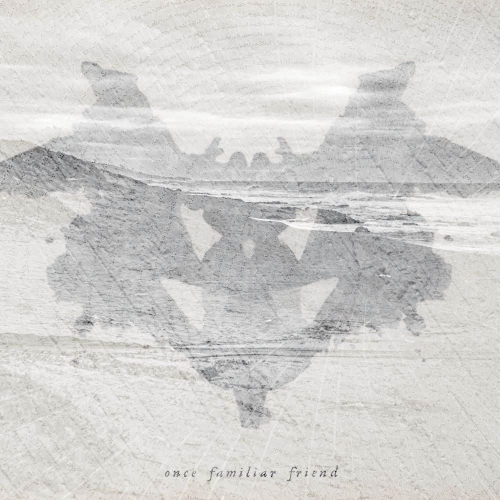 Single cover for “Once Familiar Friend” by Ray Curenton. A grayscale Rorschach inkblot is centered on a textured, light background of a rocky shore. The words "once familiar friend" appear at the bottom.