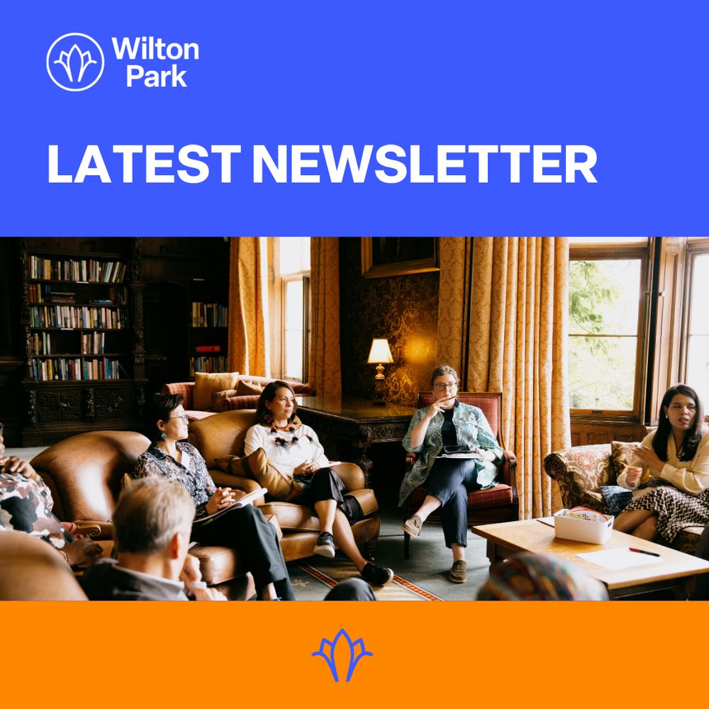 Wilton Park participants seated in chairs by large windows