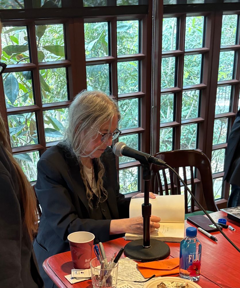 Patti Smith signing a book 