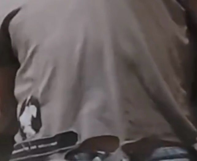 a close up of jimin’s ripped shirt. you can see the skin of his tummy and the gray waistband of his pants.