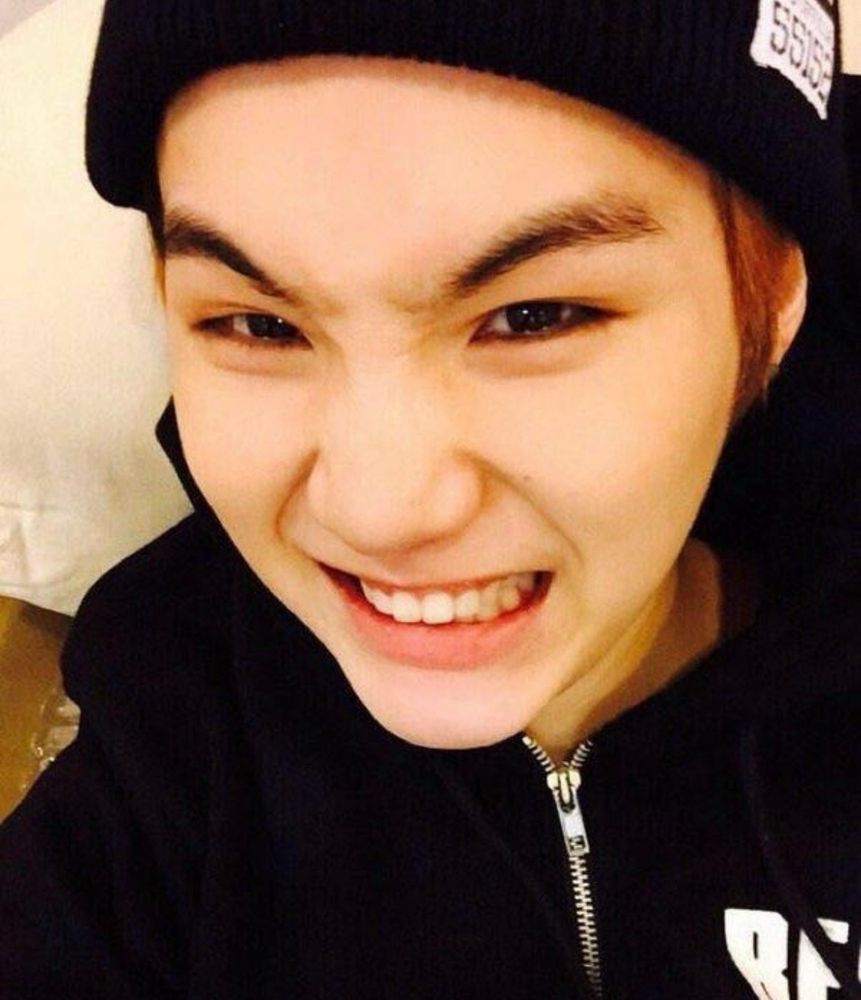 young min yoongi smiling and scrunching his nose with a smile