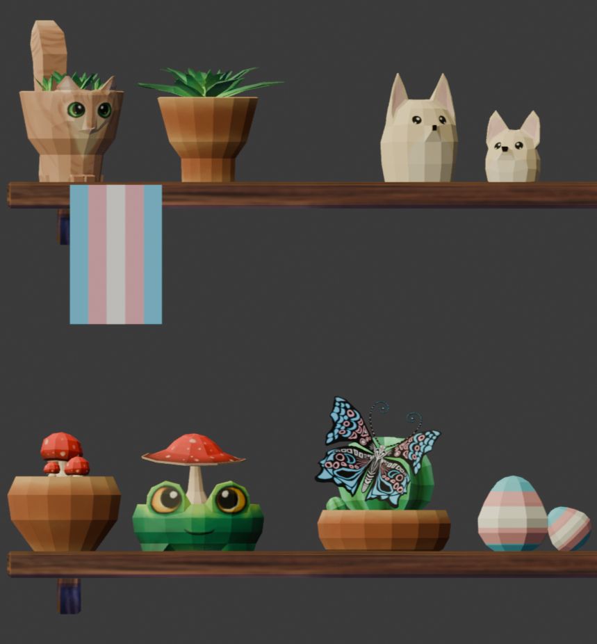 A collection of pots, plants and items, most importantly the new items, a trans flag, trans flag coloured eggs and butterfly. There us also three terracotta pots, a frog pot and cat pot containing cacti and fungi