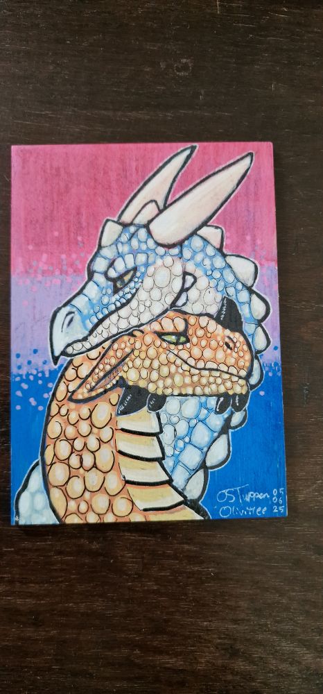 Bisexual flag with two dragons cuddling, one blue one orange.