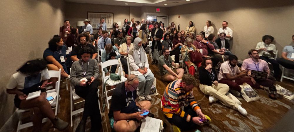 A packed conference room of YIMBYs 