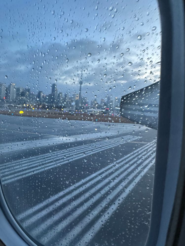 Skyline of Toronto seen though an airplane window. 