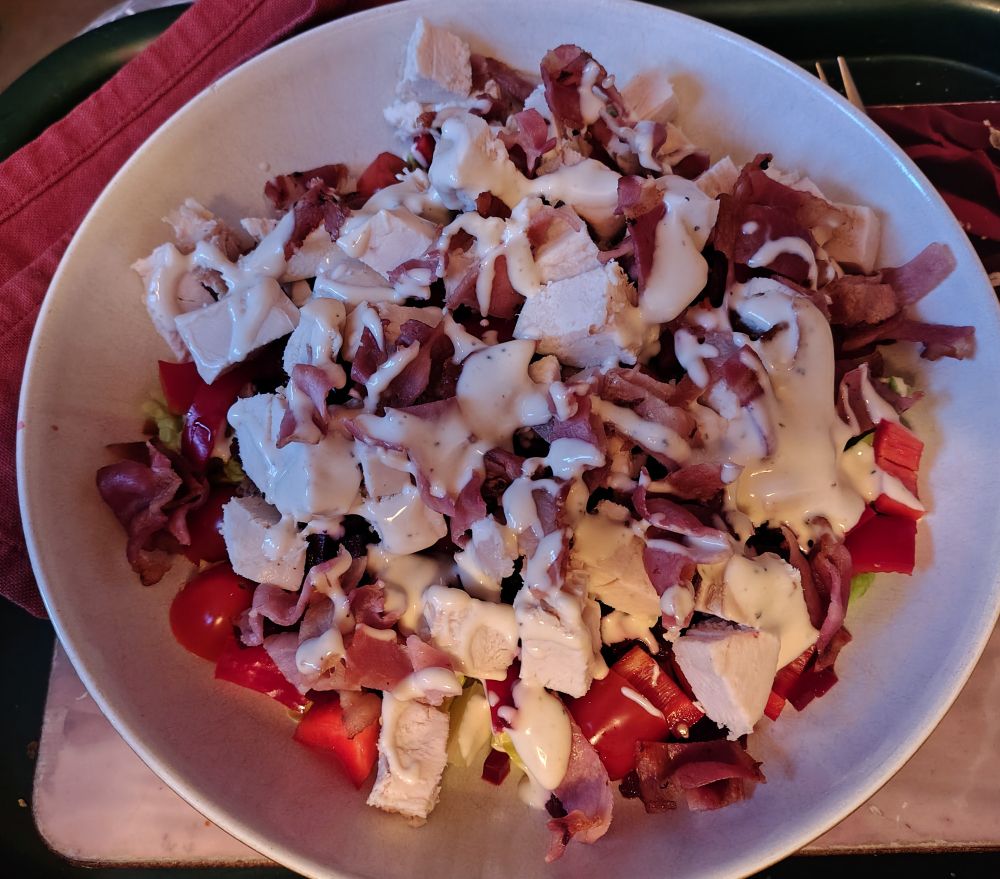 A mixed salad of tomato, lettuce, red pepper & beetroot with diced chicken breast and grilled back bacon, finished with Caesar dressing.