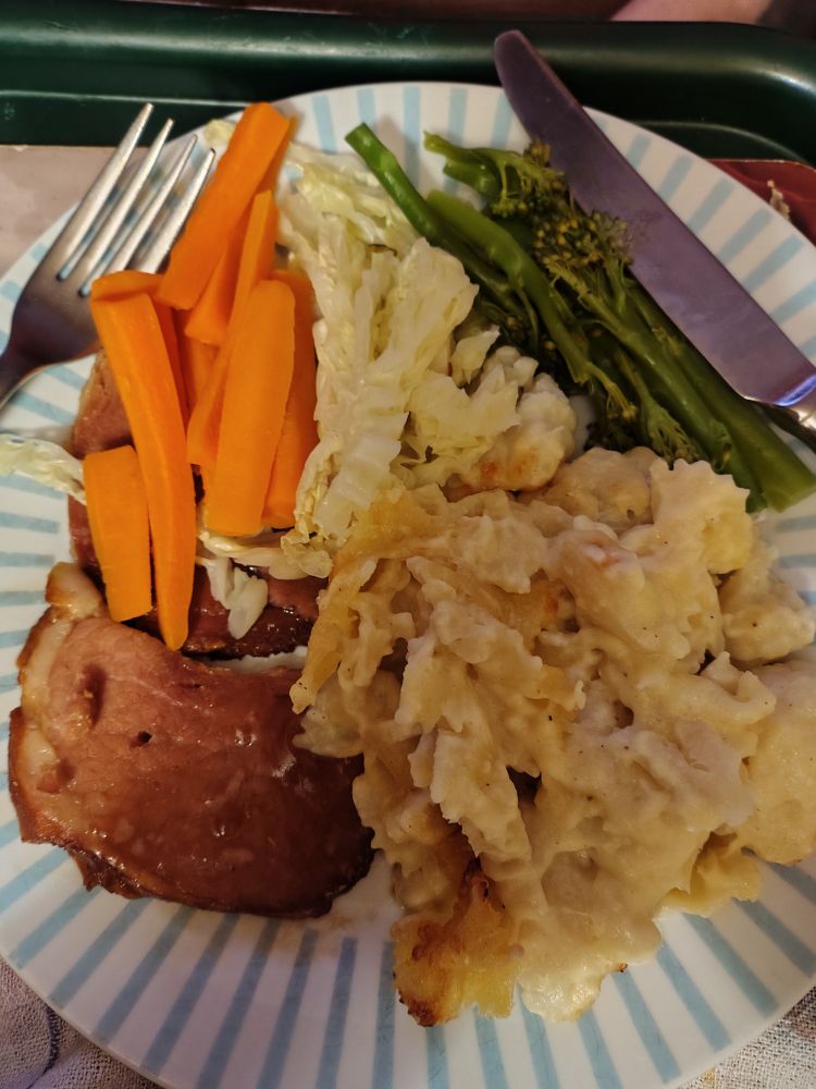 From 9 o'clock: steamed carrots, cabbage and tenderstem broccoli; gf cauliflower pasta cheese; slice of gammon ham from Christmas 2025.
