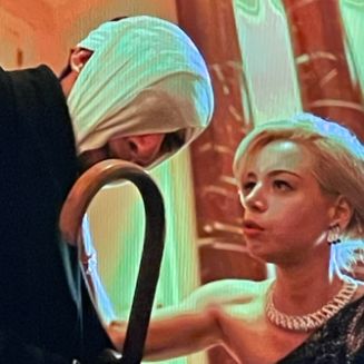 actor adam driver with a goofy bandage on his head, with beautiful actor aubrey plaza