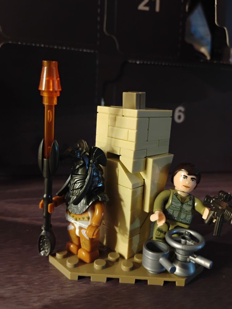 Un garde alien et un soldat caché dans un coin.