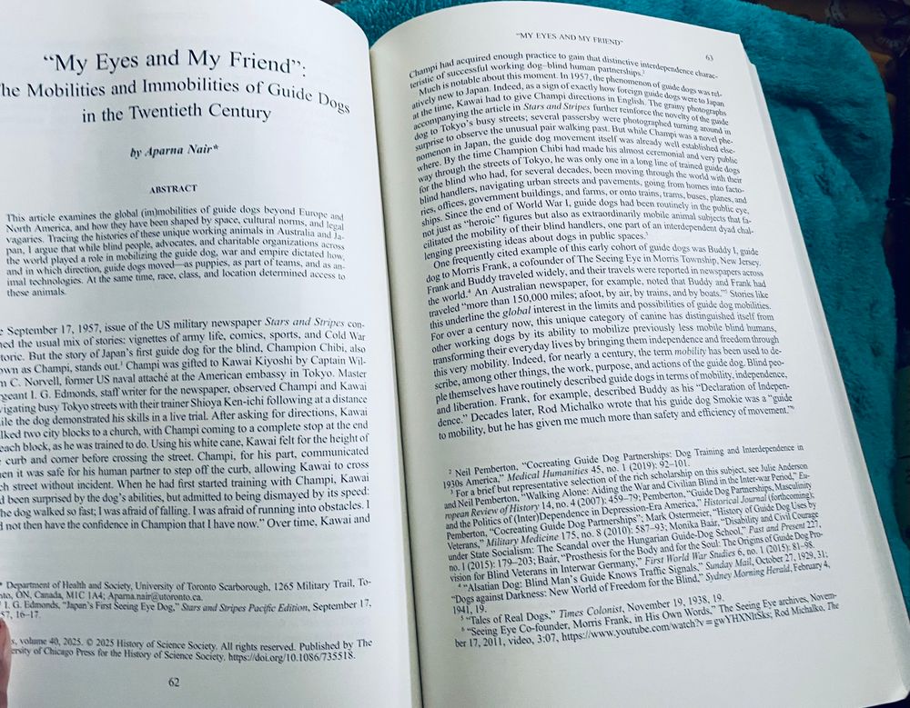 A color photo of the journal open to the first pages of my article ‘My eyes and my Friend: the mobilities and immobilities of guide dogs in the Twentieth century.’ It is seared on a heated pad seated on my lap.