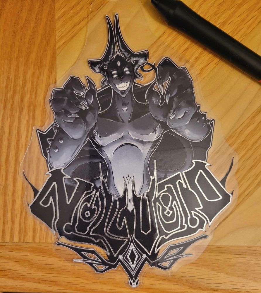 The same image as the first, but printed on archival paper with the figure intricately cut out, leaving negative space around the figure and in the eye sigil below. The name is outlined in silver metallic foil, now, and it has been laminated and cut neatly for display on a badge tag. 

The badge is resting on a wooden desk, with the artist's tablet pen next to it for scale. HELLBREAKFAST lore moment: the desk in the picture was hand-crafted by his father for his specific needs as an artist, and is one of his most cherished possessions. 