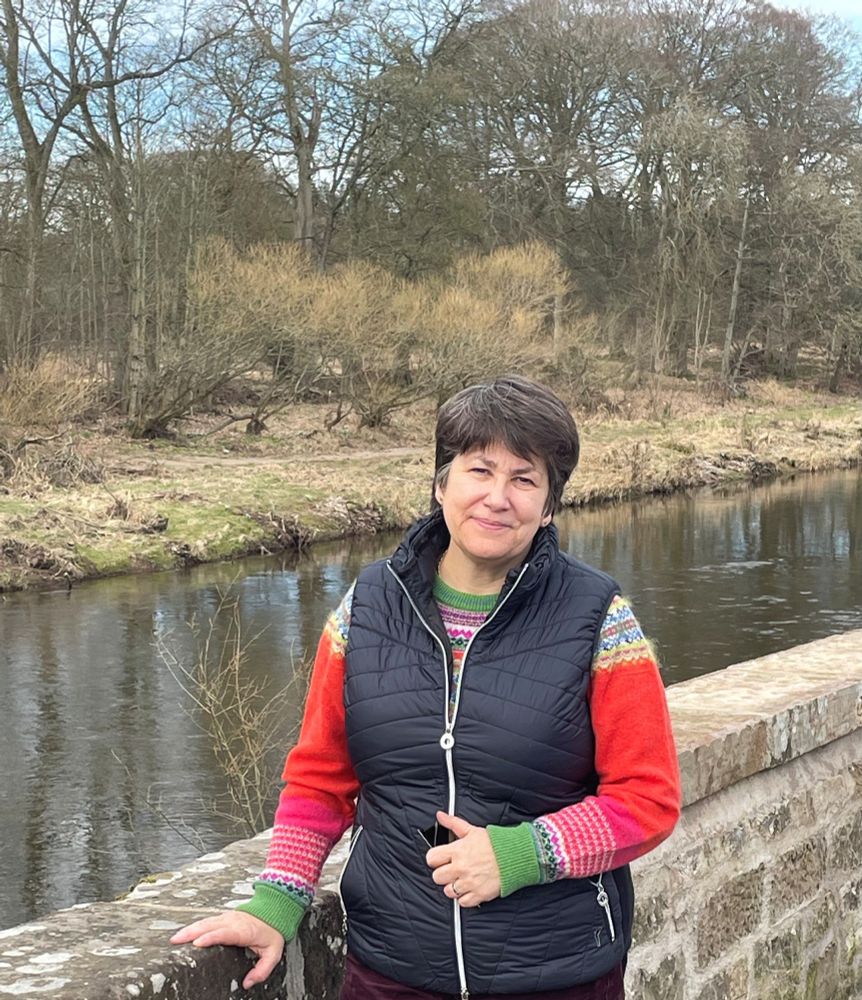 Image of Tess White MSP standing beside a river