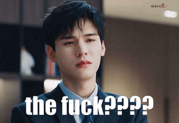 A gif of Gong Jun in his role of Xu Su. He is wearing a suit and making an annoyed face. The words “the fuck????” appear in white letters at the bottom.
