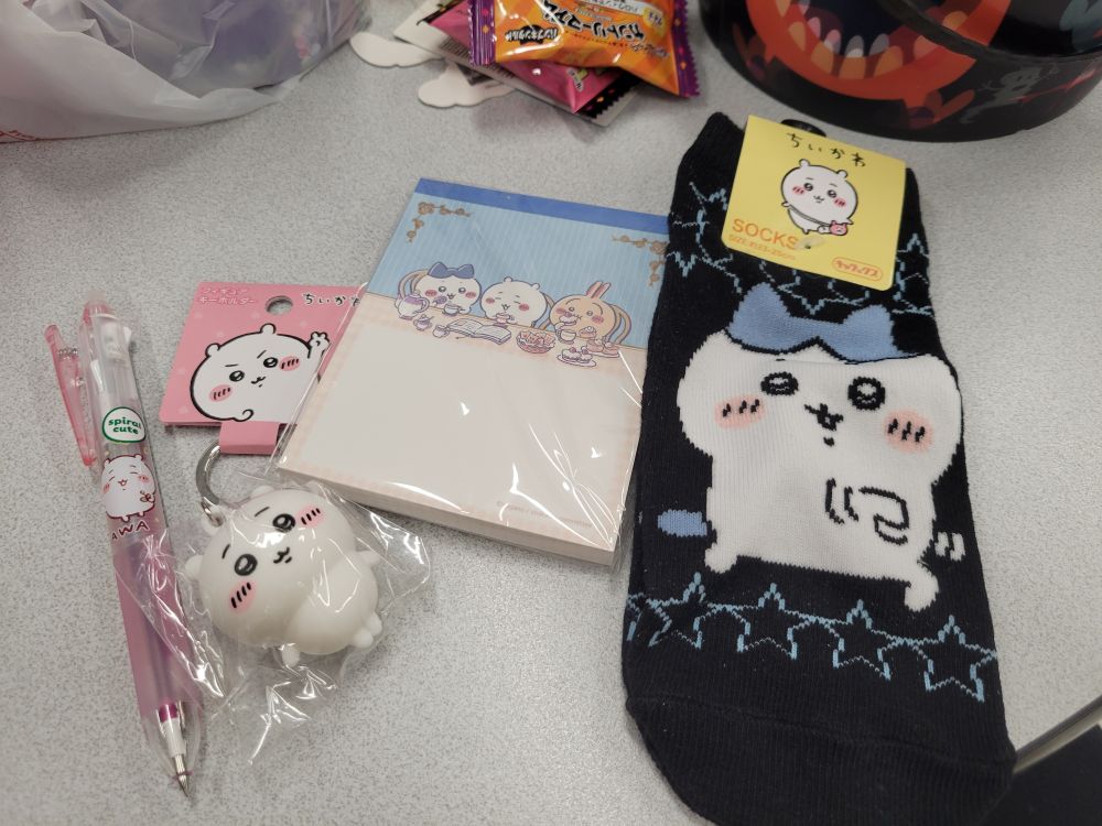 Chiikawa socks, a notepad, keychain and pen 