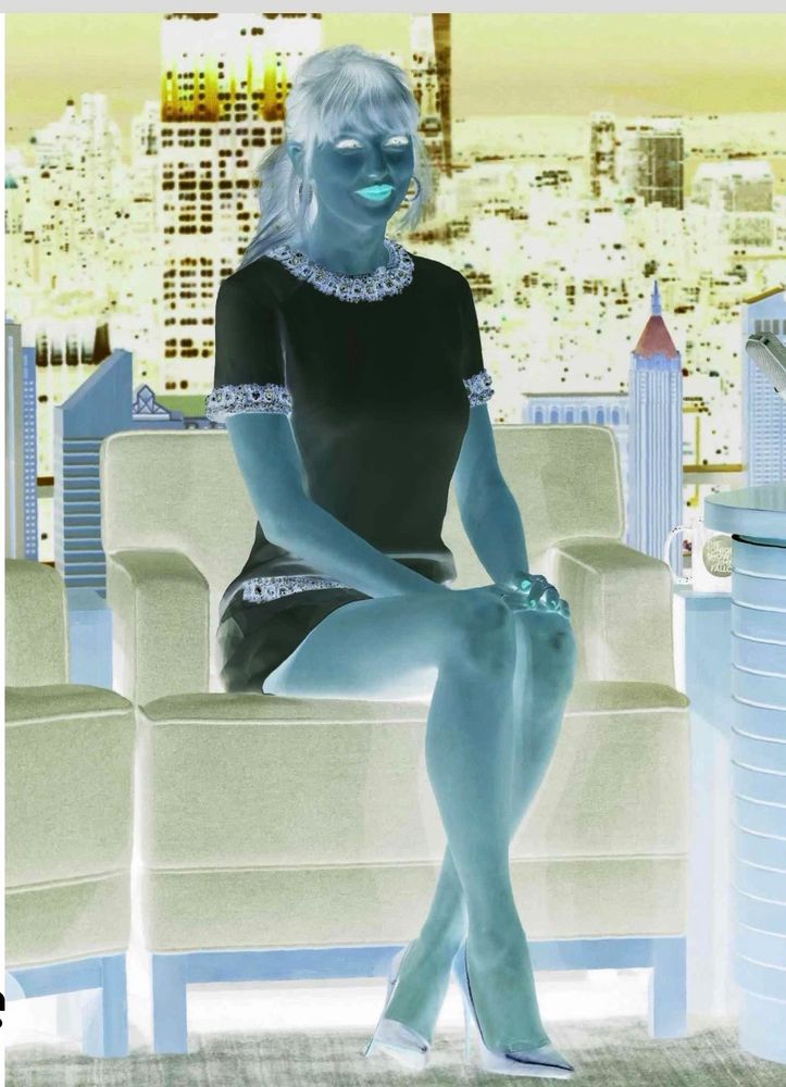 The inverse of the outfit she wore to Jimmy Fallon’s interview in 2022. Instead of white and gold, the dress is black and silver 