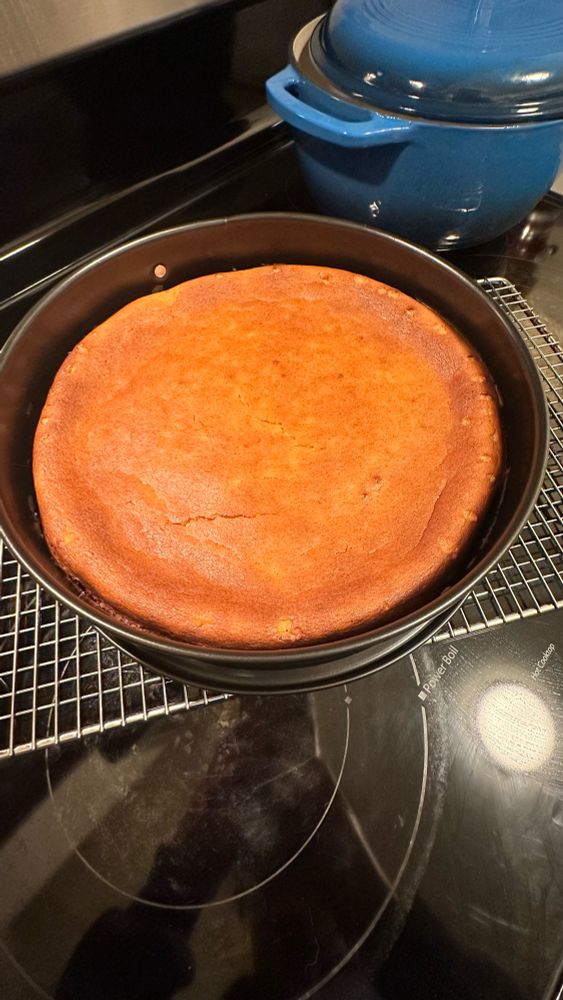 Cheesecake cooling on wire rack