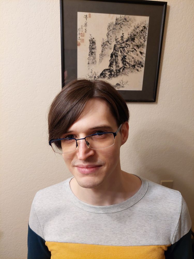 About 6 months into HRT; beginning to explore some more feminine hairstyles.