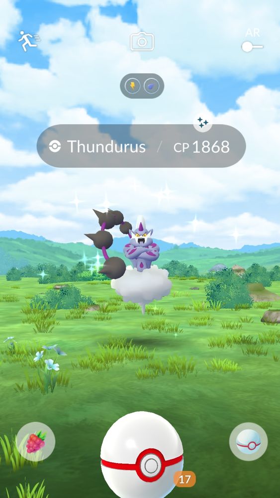 Pokémon GO screenshot. Shiny Thundurus Incarnate Forme about to be caught after a raid.