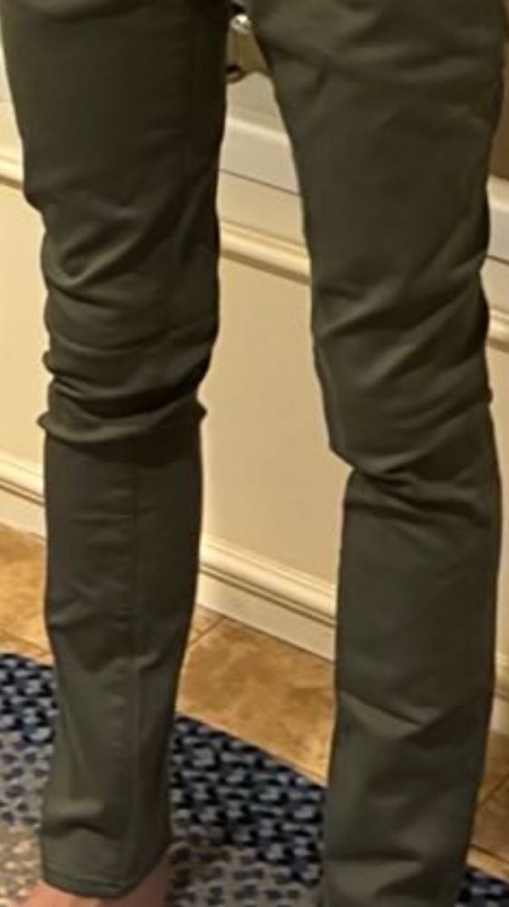Very tight green jeans. 