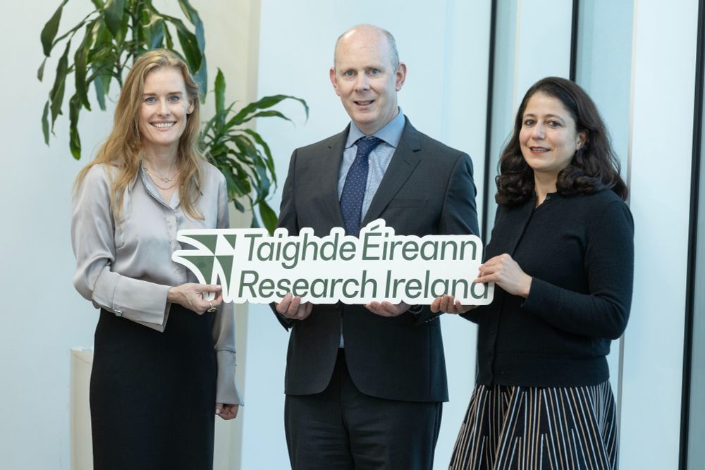Pictured at the announcement of Research Ireland COALESCE Programme funding were (left-right): Dr Stephanie O’Keeffe, Cuan CEO; Dr Diarmuid O'Brien, CEO Research Ireland; and COALESCE awardee, Prof. Roja Fazaeli, University of Galway. They are holding a cardboard cutout with the words Taighde Éireann / Research Ireland(Photo: Finbarr O'Rourke). 
