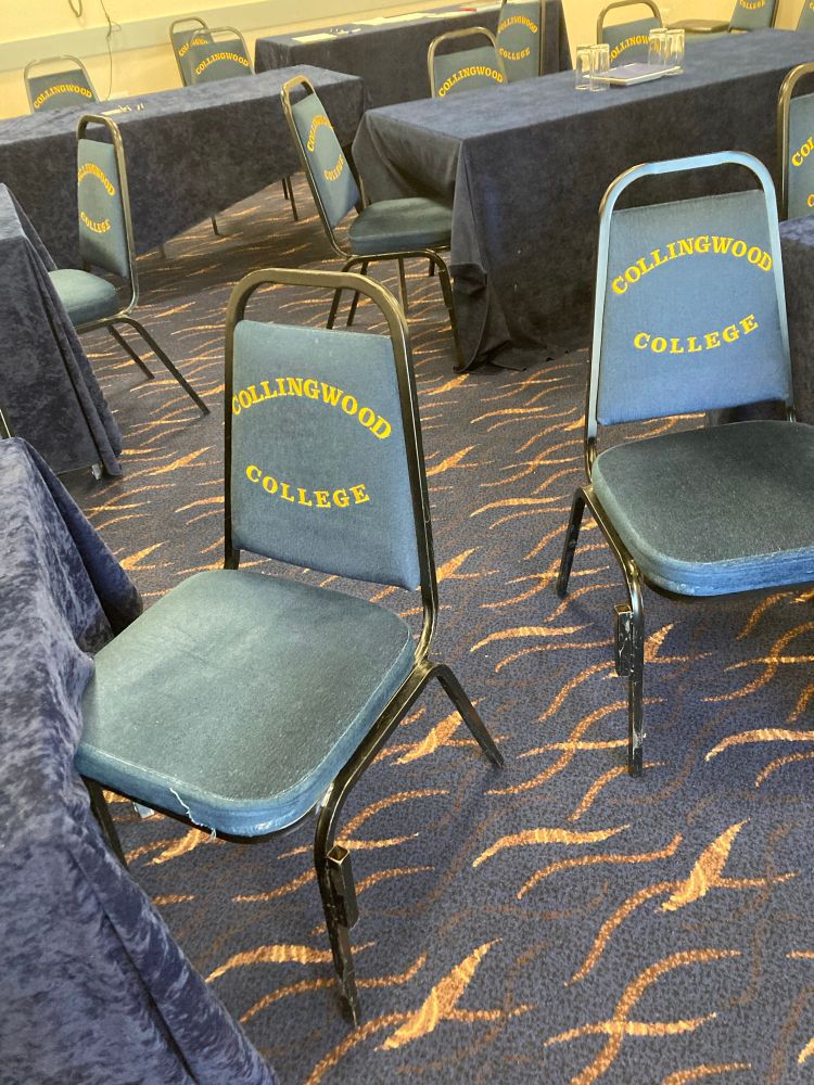 Two chairs with the Collingwood College insignia on the back!